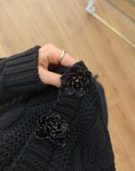 Black cable knit cardigan with floral buttons - Image 3