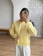 Yellow knit cardigan with cable details