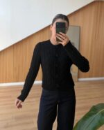 Black cable knit cardigan with floral buttons