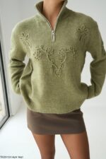 Olive green sweater with design