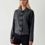 Grey knit cardigan with bow shaped buttons