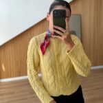 Yellow cable knit cardigan with floral buttons