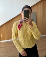Yellow cable knit cardigan with floral buttons
