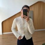 White cable knit cardigan with floral buttons