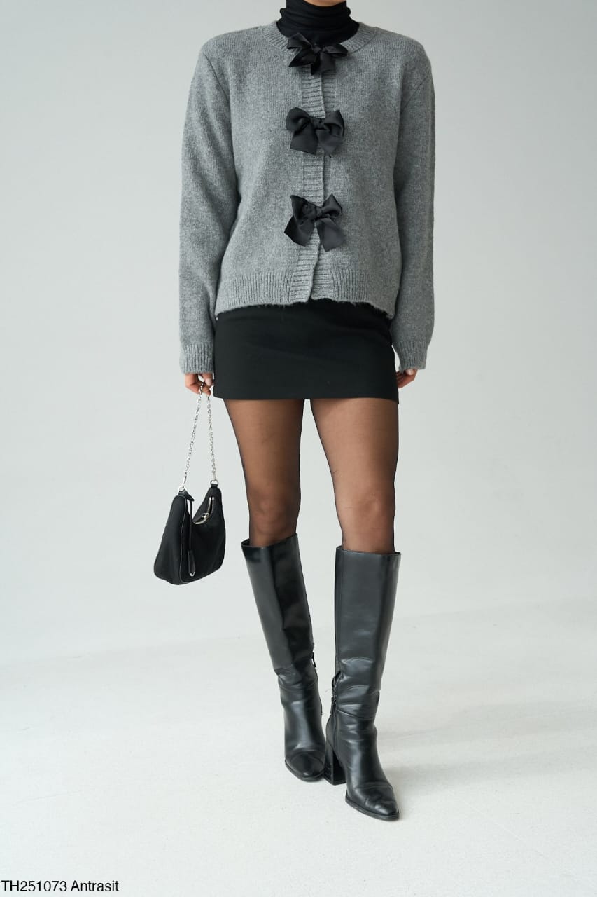 c8a7928d-c0e4-451e-b930-88bd78cfe8f6 Grey Knit Cardigan with Black Bows - Image 1
