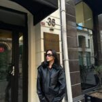 Black leather jacket with fur collar